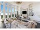 Two story living room with a large sectional sofa and fireplace at 1055 Leadenhall St, Alpharetta, GA 30022
