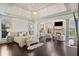 Luxurious main bedroom with sitting area and fireplace at 1055 Leadenhall St, Alpharetta, GA 30022
