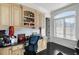 Home office with built-in cabinets, desk, and large window at 1055 Leadenhall St, Alpharetta, GA 30022
