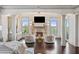 Main bedroom sitting area with fireplace and large windows at 1055 Leadenhall St, Alpharetta, GA 30022