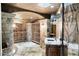 Finished basement wine cellar with stone walls and ample storage at 1055 Leadenhall St, Alpharetta, GA 30022