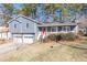 Two-story house with attached garage, red front door, and spacious yard at 296 Ridgedale Way, Lawrenceville, GA 30044