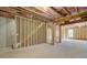 Unfinished basement with framed walls and exposed insulation at 301 Delta Dr, Mcdonough, GA 30252