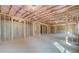 Unfinished basement with framed walls and exposed insulation at 301 Delta Dr, Mcdonough, GA 30252