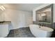 Bathroom features a soaking tub, walk-in shower, and double vanity at 301 Delta Dr, Mcdonough, GA 30252