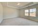 Spacious bedroom with large windows and carpet at 301 Delta Dr, Mcdonough, GA 30252