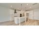 Modern kitchen with white cabinets and a large island at 301 Delta Dr, Mcdonough, GA 30252