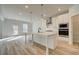 Modern kitchen with white cabinets and a large island at 301 Delta Dr, Mcdonough, GA 30252