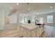 Open concept kitchen with island and stainless steel appliances at 301 Delta Dr, Mcdonough, GA 30252