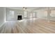 Spacious living room featuring hardwood floors and fireplace at 301 Delta Dr, Mcdonough, GA 30252