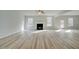 Open living room with hardwood floors and fireplace at 301 Delta Dr, Mcdonough, GA 30252