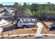 Aerial view of a modern farmhouse situated on a tree-lined street at 39 Telfair Ct, Acworth, GA 30101