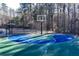 Outdoor basketball court with blue and green accents at 39 Telfair Ct, Acworth, GA 30101