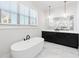 Elegant bathroom with soaking tub, marble tile, and modern vanity at 39 Telfair Ct, Acworth, GA 30101