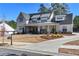 Two-story farmhouse with metal roof, landscaping, and driveway at 39 Telfair Ct, Acworth, GA 30101