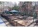 playground with swings, slides, and shaded areas at 39 Telfair Ct, Acworth, GA 30101