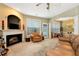 Living room with fireplace, access to patio and dining area at 1967 Woodland Park Cir, Lawrenceville, GA 30043