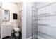 Small bathroom with white vanity and storage shelving at 266 11Th Ne St # 308, Atlanta, GA 30309