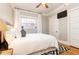 Cozy bedroom with hardwood floors and white bedding at 266 11Th Ne St # 308, Atlanta, GA 30309