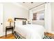 Bedroom with hardwood floors and white bedding at 266 11Th Ne St # 308, Atlanta, GA 30309