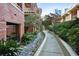 Landscaped courtyard with walking path and lush greenery at 266 11Th Ne St # 308, Atlanta, GA 30309