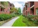 Landscaped courtyard with walking path and lush greenery at 266 11Th Ne St # 308, Atlanta, GA 30309