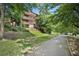 Building exterior nestled amongst trees and a walking path at 266 11Th Ne St # 308, Atlanta, GA 30309