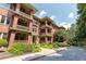 Brick apartment building with balconies and lush landscaping at 266 11Th Ne St # 308, Atlanta, GA 30309