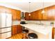 Modern kitchen with wood cabinets and granite counters at 266 11Th Ne St # 308, Atlanta, GA 30309