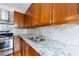 Kitchen features granite countertops and wood cabinets at 266 11Th Ne St # 308, Atlanta, GA 30309