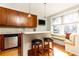 Modern kitchen with wood cabinets, granite counters, and island at 266 11Th Ne St # 308, Atlanta, GA 30309