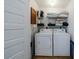 Convenient laundry room with washer, dryer, and shelving at 266 11Th Ne St # 308, Atlanta, GA 30309