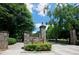 Entrance to Piedmont Park in Atlanta, featuring stone pillars and lush greenery at 266 11Th Ne St # 308, Atlanta, GA 30309