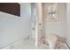 Powder room area with marble floor and walls and modern fixtures at 2015 Shaudi Ln, Atlanta, GA 30345