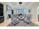 Sophisticated living room with fireplace, piano, bay windows, and stylish seating arrangement at 2015 Shaudi Ln, Atlanta, GA 30345