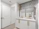 Modern bathroom with double vanity, gold fixtures, and marble-tiled shower at 2933 5Th Sw St, Atlanta, GA 30315