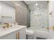 Modern bathroom with a bathtub, shower, and marble tile at 2933 5Th Sw St, Atlanta, GA 30315