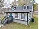 Charming craftsman style home with gray exterior, blue door and landscaping at 2933 5Th Sw St, Atlanta, GA 30315