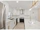 Modern kitchen with white cabinets, stainless steel appliances and island at 2933 5Th Sw St, Atlanta, GA 30315