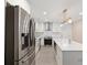 Modern kitchen with white cabinets, stainless steel appliances and island at 2933 5Th Sw St, Atlanta, GA 30315