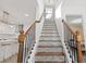 Elegant staircase with wood railings and mosaic tile at 2933 5Th Sw St, Atlanta, GA 30315