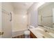 Bright bathroom featuring a shower-tub combo, single sink vanity, and modern fixtures at 3332 Fannin Ct, Lithonia, GA 30038