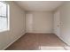 Bedroom with neutral walls, carpet, a window and two white doors at 3332 Fannin Ct, Lithonia, GA 30038