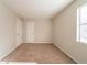 Bedroom with neutral walls, carpet, and a window at 3332 Fannin Ct, Lithonia, GA 30038