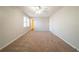 Spacious bedroom featuring neutral walls, carpet, ceiling fan, and windows at 3332 Fannin Ct, Lithonia, GA 30038
