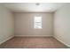 Bedroom with neutral walls, carpet, and a window at 3332 Fannin Ct, Lithonia, GA 30038