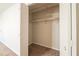 Bedroom closet featuring an open bi-fold door, neutral paint, rod, and shelf at 3332 Fannin Ct, Lithonia, GA 30038