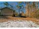 Exterior shot of the house in a wooded setting at 3332 Fannin Ct, Lithonia, GA 30038