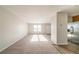 Spacious living room with new carpet, neutral walls, and windows for natural light at 3332 Fannin Ct, Lithonia, GA 30038