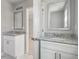 Bright bathroom featuring double sinks with granite countertops and vanities at 3108-A Brownstone Se Ln, Atlanta, GA 30354